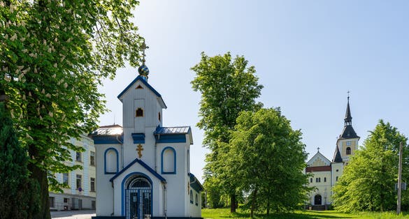 Photo of Orthodox and Catholic churches in Michalkovice district in Ostrava, Czech Republic.