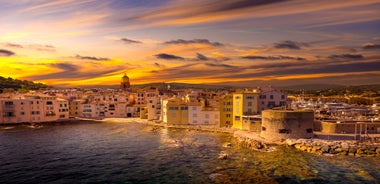 Photo of beautiful aerial view of Saint-Tropez, France with seascape and blue sky.