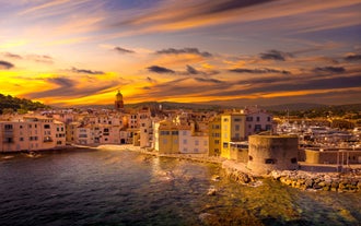 Photo of beautiful aerial view of Saint-Tropez, France with seascape and blue sky.
