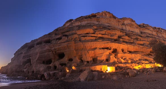 photo of view ofPanorama of the Matala beach, Crete, Greece. The panoramic image has been stitched from multiple photos.,Mátala Greece.
