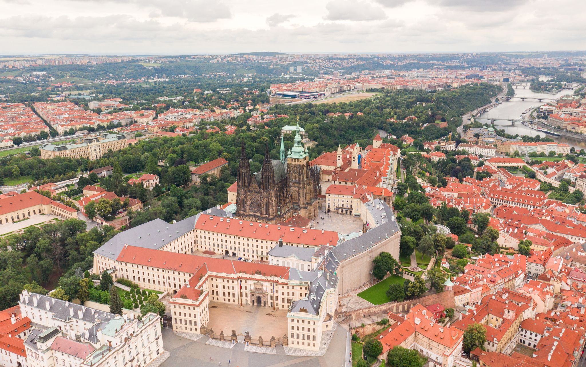 Photo of aerial view of Prague Old Town with St. Vitus Cathedral and Prague castle complex with buildings revealing architecture from Roman style to Gothic 20th century, Czech.