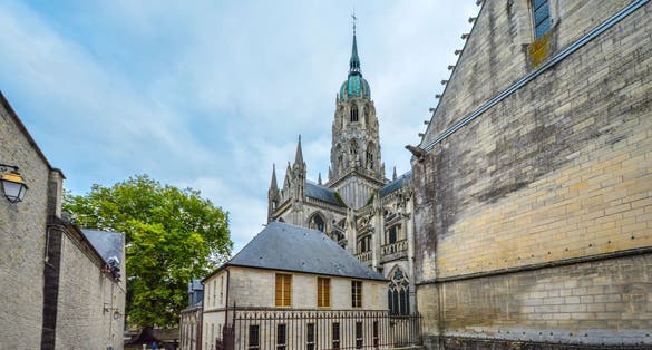 Photo of the tower and dome of the medieval Cathedral of Our Lady of Bayeux, is a Roman Catholic church located in the town of Bayeux in Normandy, France.