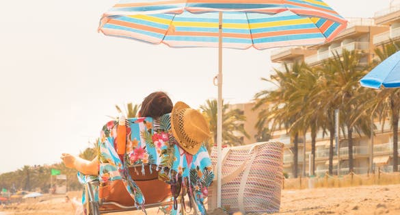 Relaxing on vacation on one of Costa Daurada's beaches.