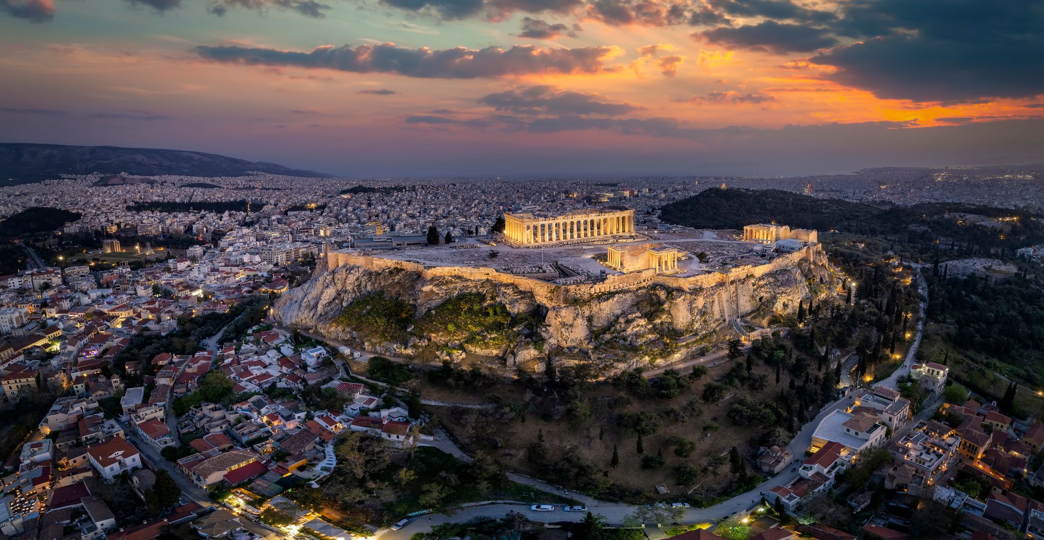 Photo of panoramic view of the illuminated Acropolis of Athens, Greece.