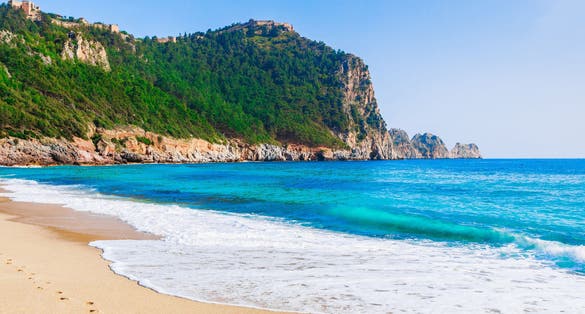 photo of Cleopatra beach with sea, sand and rocks in Alanya, Antalya, Turkey.