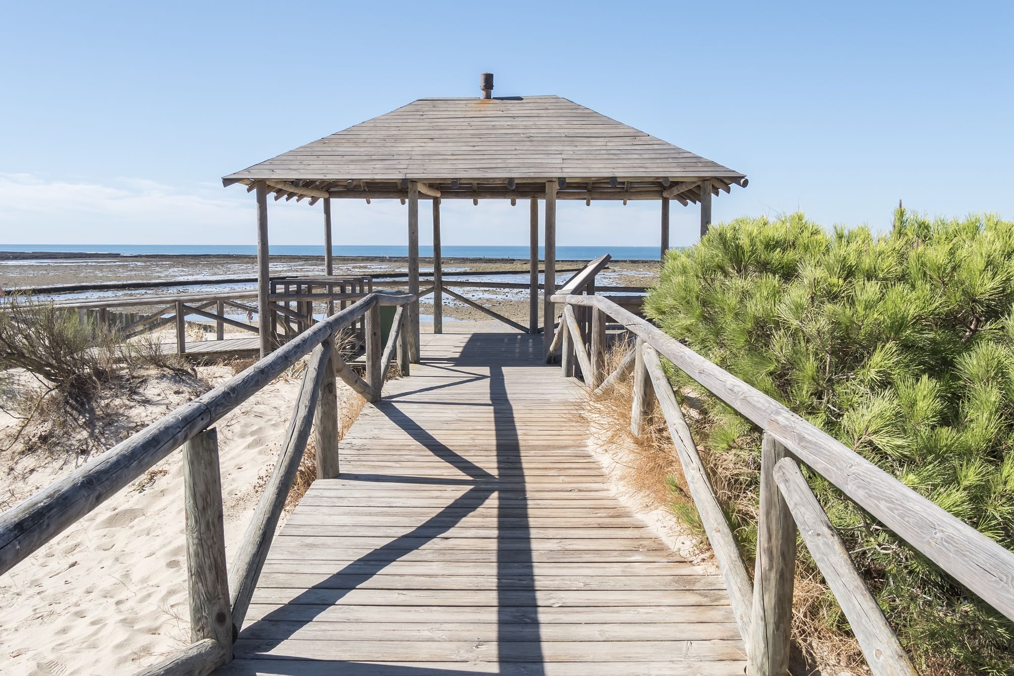photo  of view of Punta Candor beach, Rota, Cadiz, Spain. Fishing weir, fish weir, fishgarth or kiddle