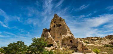 Hot air balloons flying over Uchisar Castle. Cappadocia. Nevsehir Province. Turkey.