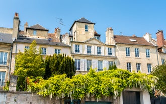 Photo of traditional half-timbered houses in the old town of Rennes, Brittany, France.