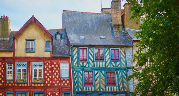 Photo of beautiful half-timbered buildings in medieval town of Rennes, France.