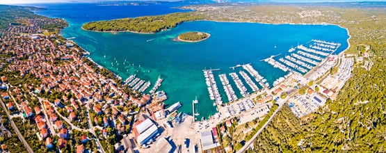 Punat. Town of Punat and monastery island of Kosljun aerial panoramic view, Island of Krk, Kvarner bay of Croatia