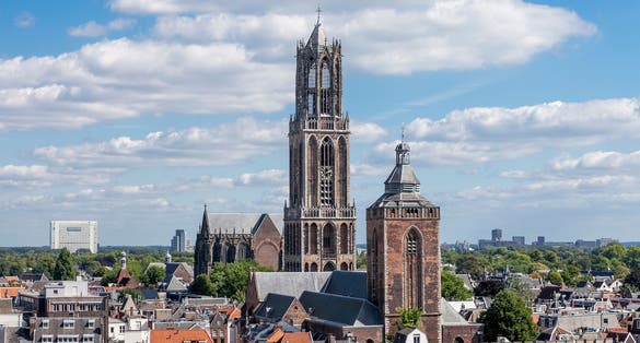 photo of view of UTRECHT, NETHERLANDS - MAY 25, 2013: Zadelstraat street leading to the tower of Utrecht, the Netherlands.