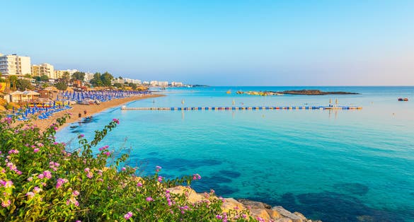 Photo of sandy beach and turquoise water of Fig tree bay beach, Protaras, Cyprus. 