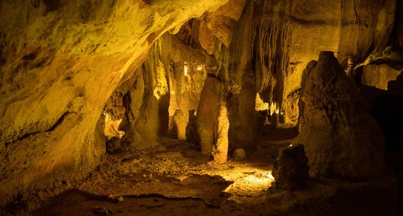Illuminated lit lights stalagmites stalactites limestone show cave cavern Grutas da Moeda in Batalha Leiria Regiao do Centro Portugal Europe