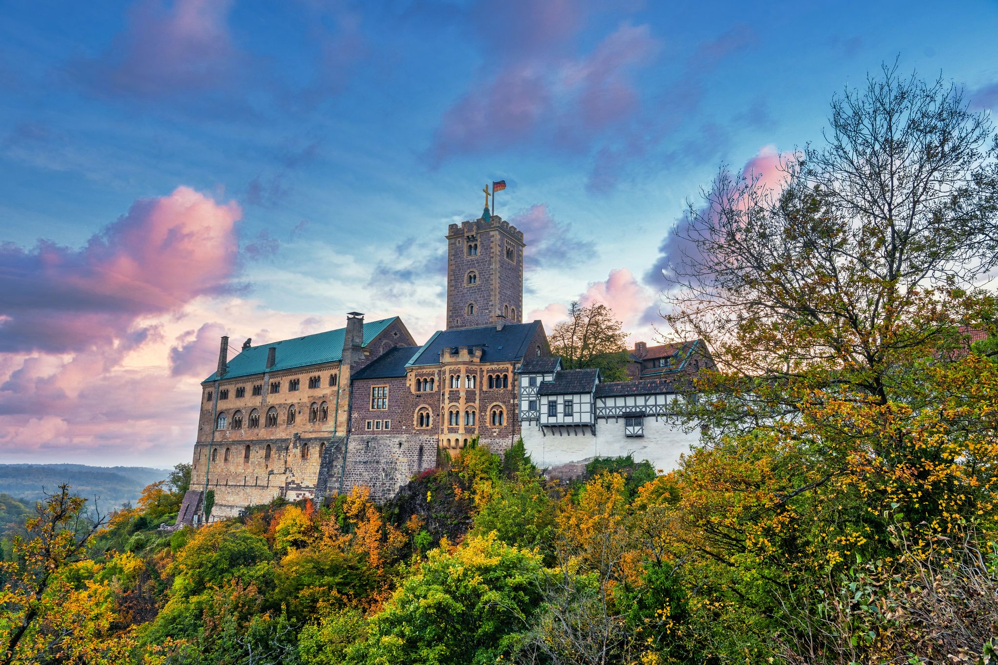 photo of view of Classic panoramic view of Wartburg Castle in the Thuringian Forest near Eisenach, Thuringia, Germany.