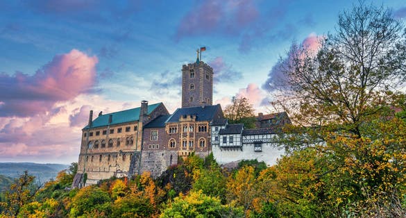 photo of view of Classic panoramic view of Wartburg Castle in the Thuringian Forest near Eisenach, Thuringia, Germany.