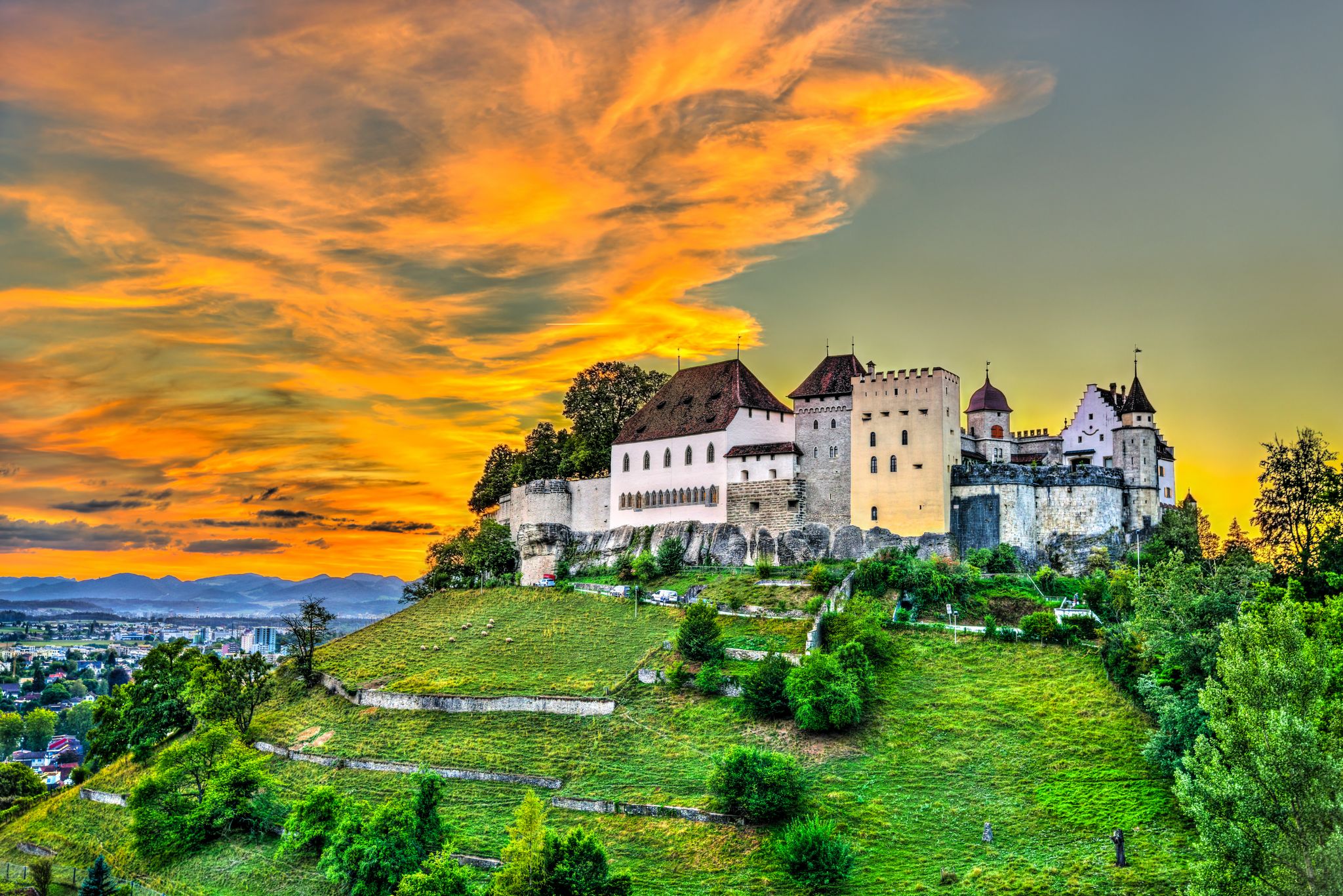 photo of Lenzburg Castle in Aargau, Switzerland at sunset.