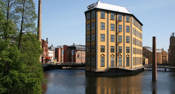 The Strykjärnet (Clothes Iron) building on the Motala River with the Museum of Work