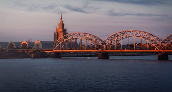 Railway Bridge and Latvian Academy of Sciences at sunset - Riga, Latvia