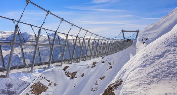 photo of Titlis Cliff Walk in Mount Titlis in the Swiss Alps in winter time.