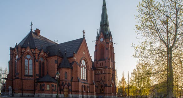 photo of the City Church of Umeå in evening sunshine in Sweden.