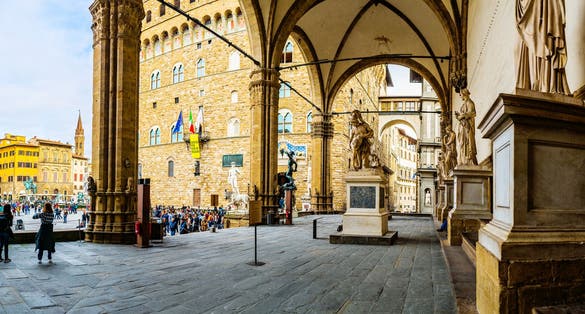 photo of view of Loggia dei Lanzi, also called Loggia della Signoria, is a building on corner of Piazza della Signoria in Florence, Italy.