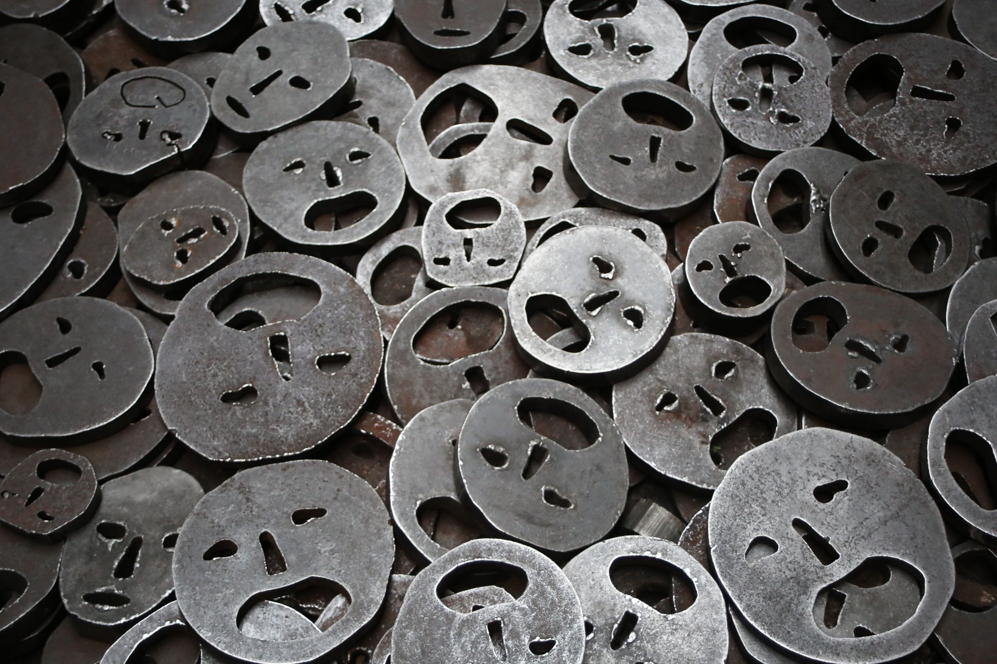 Round iron that resembles the shape of a sad face.
