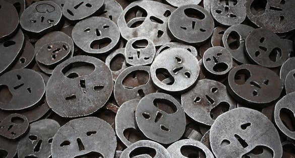 Round iron that resembles the shape of a sad face.