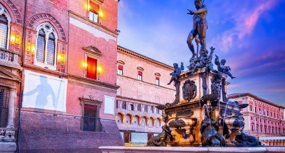 photo of Bologna, Italy. Piazza del Nettuno and Piazza Maggiore in Bologna, Italy landmark in Emilia-Romagna historical province.