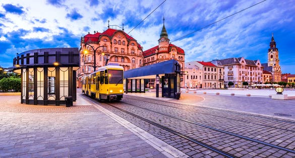 Oradea, Transylvania with tram station in Union Square cityscape in Romania.