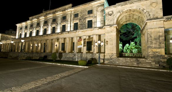 photo of view Old British palace by night at Corfu Island, Greece.