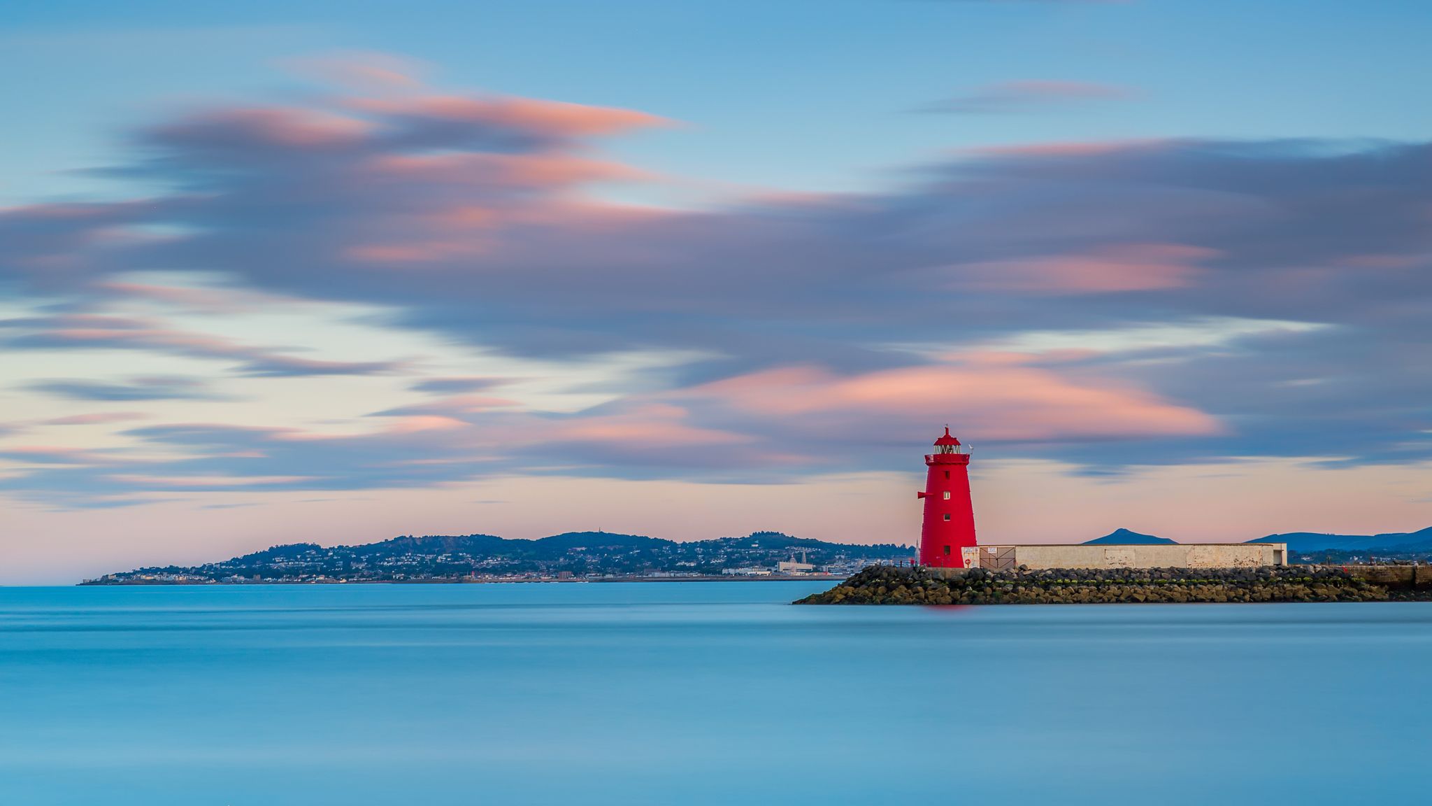 photo of view of Aerial view Sunset Poolbeg lighthouse in Ireland, Dublin bay Pier to Poolbeg Lighthouse in Ireland.