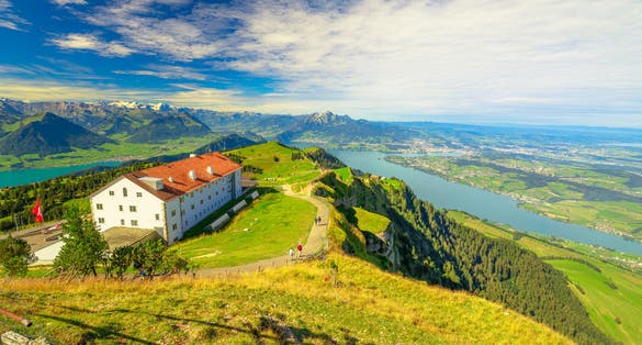 photo of along trail around Rigi Kulm, the highest peak on Mount Rigi over 13 lakes and peaks of Swiss Alps. Canton of Lucerne, Central Switzerland. Green meadows, outdoor activities in summer.