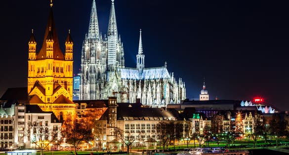 photo of view of Cologne Cathedral and Hohenzollern Bridge through Rhine river aerial panoramic view in Cologne, Germany