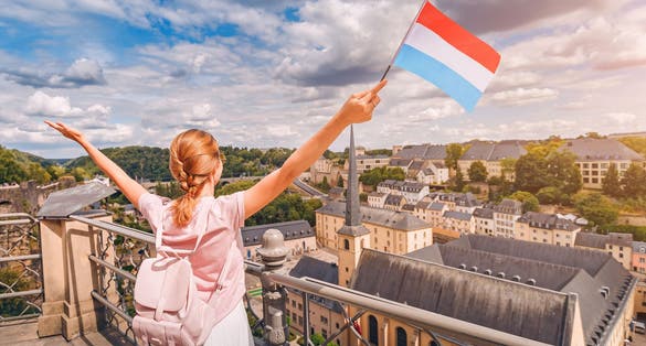 Photo of girl holds the flag of Luxembourg ,recreation and life in the country.