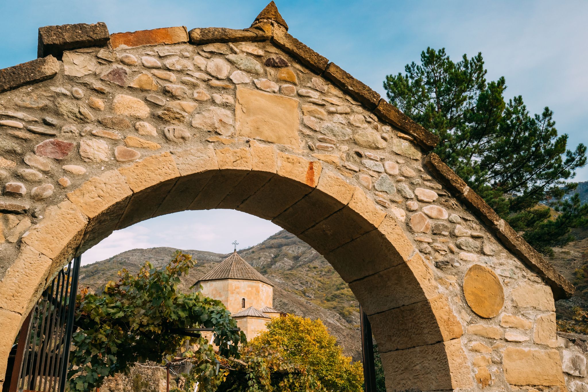 Photo of Arch Entrance Gates To Georgian Orthodox Ateni Sioni Church Is In The Village Of Ateni, Some 10 Km South Of The City Of Gori, Georgia. 