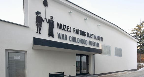 SARAJEVO, BOSNIA AND HERZEGOVINA -  Children playing in front of War Childhood Museum in Sarajevo.