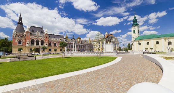 Union square (Piata Unirii) Oradea, Romania, cityscape with beautiful clouds.