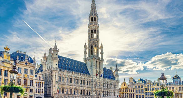 photo of view of The Grand-Place Grote Markt Big Market square in Brussels city historical center with crowd people tourists, Town Hall Brabantine Gothic style and Baroque guildhalls Guilds of Brussels, Belgium