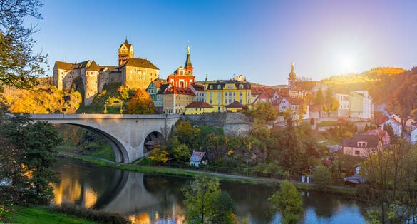 Photo of Colorful town Loket in autumn over Eger river in the Sokolov District in the Karlovy Vary region of the Czech Republic.