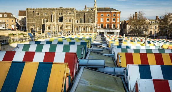 Photo of the colourful rooftops on Norwich Market, UK.