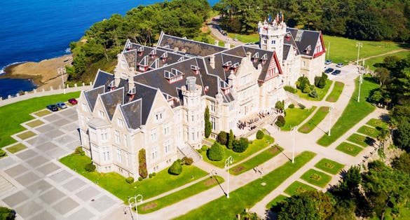 Photo of Magdalena Palace or Palacio de la Magdalena aerial panoramic view. It is a palace located on the Magdalena Peninsula in Santander city, Spain.