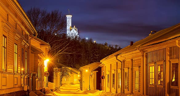photo of small Swedish European town Soderhamn at night with Oscarsborg.