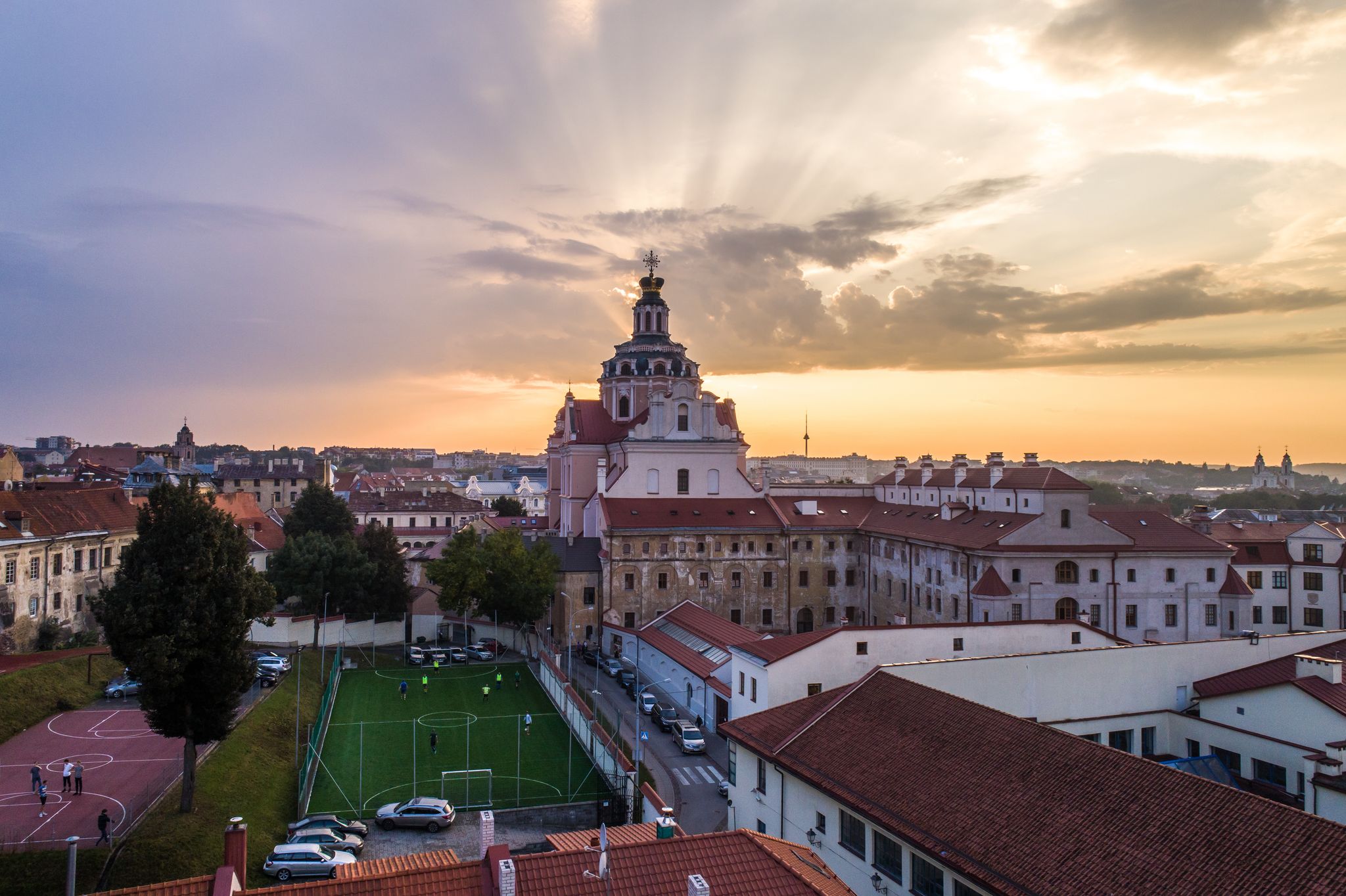 Aerial evening view of Church of St. Casimir and sport facilities in Vilnius old town, Lithuania0.