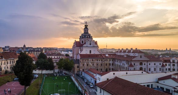 Aerial evening view of Church of St. Casimir and sport facilities in Vilnius old town, Lithuania0.