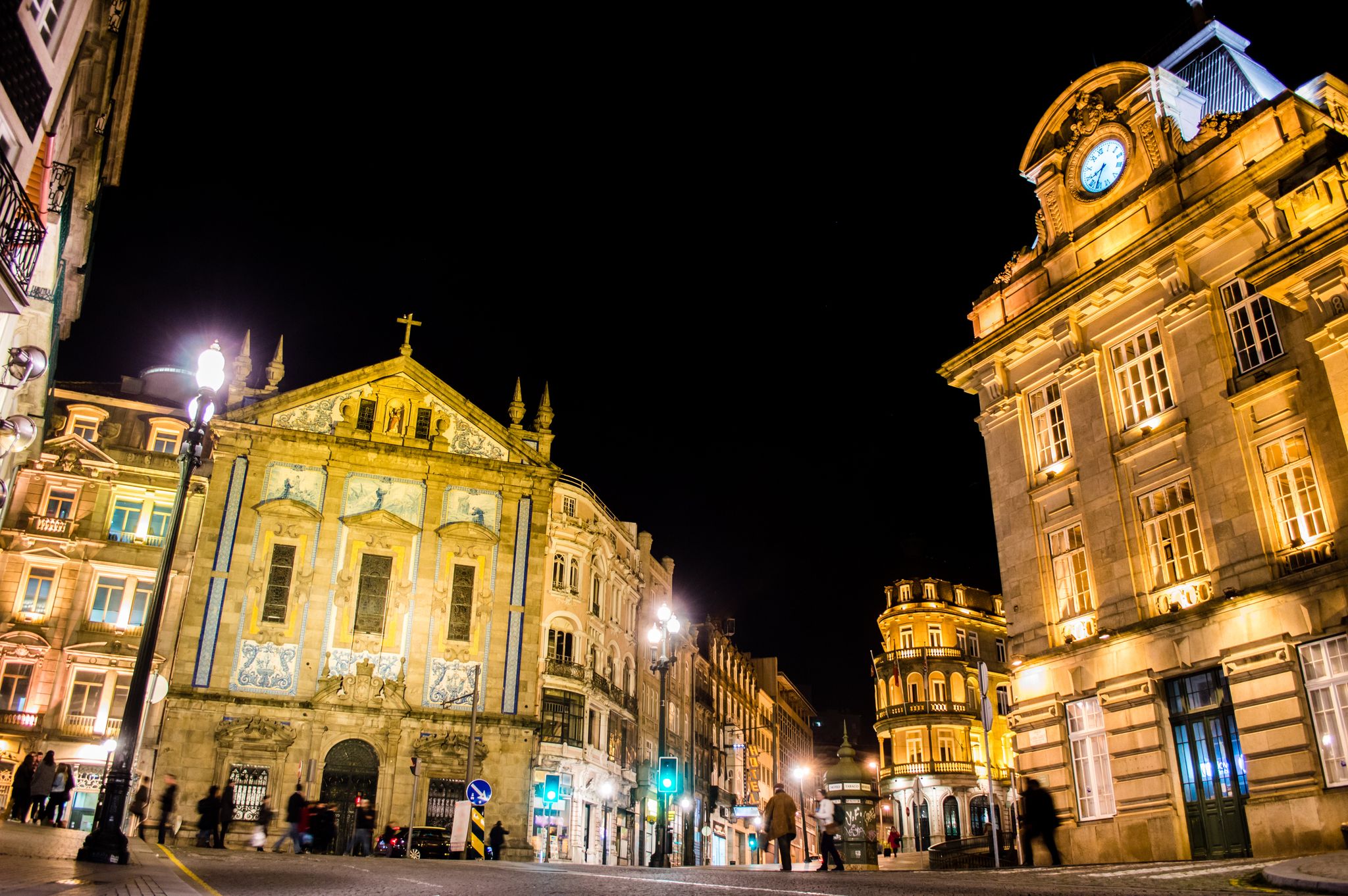 Saint Anthony's Church Congregados, Sao Bento railway station on the Praca de Almeida Garrett at night time in Porto, Portugal.