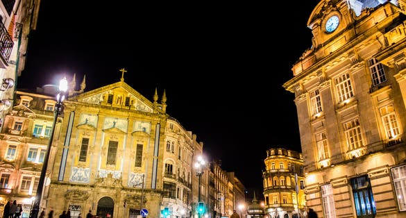 Saint Anthony's Church Congregados, Sao Bento railway station on the Praca de Almeida Garrett at night time in Porto, Portugal.