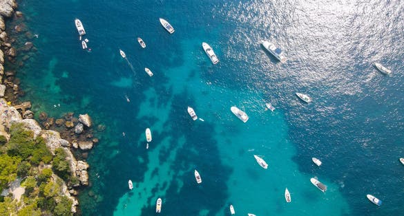  Beautiful rocky beach near coastal path on the Cap d'Antibes, Antibes, France. Drone view of Côte d’Azur.