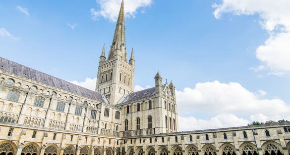 Photo of Norwich cathedral on a sunny day in Norwich, Norfolk, England.
