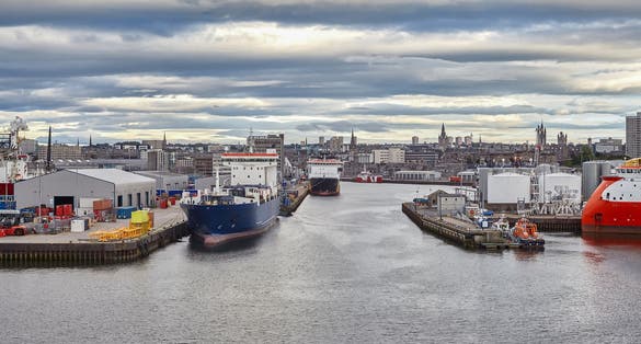 photo of view of Panoramic view of Aberdeen Port, during working day with different vessels moored.