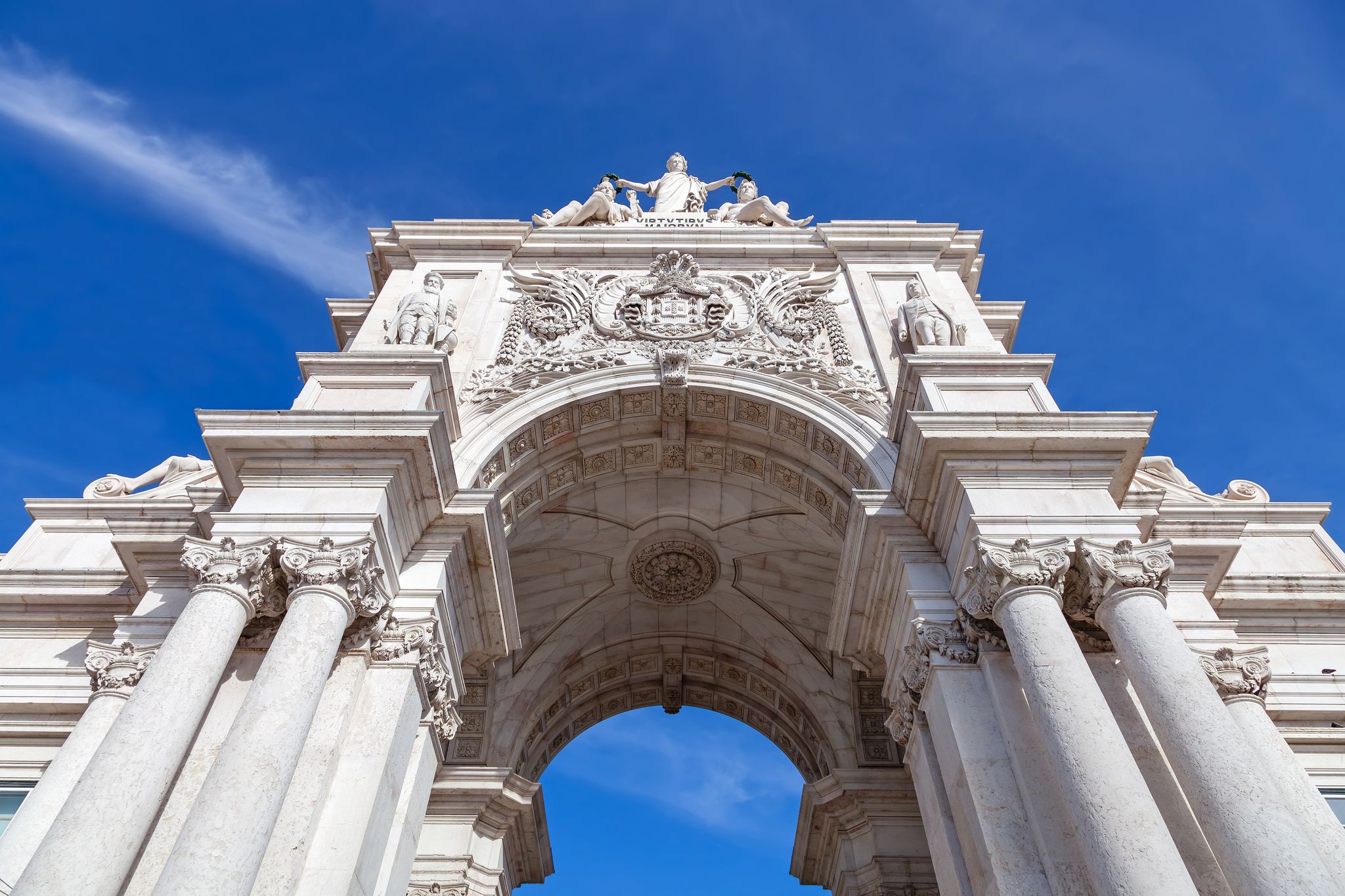 Photo of Lisbon, Portugal. Looking up at the iconic Augusta Street Triumphal Arch in the Commerce Square, Praca do Comercio or Terreiro do Paco.